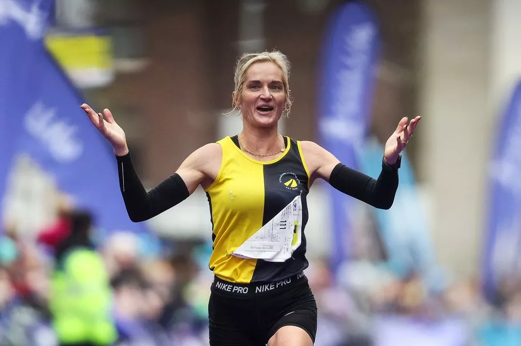 Ann-Marie McGlynn of Strabane AC on her way to crossing the finish line to finish second in the Women's national title at the 2025 Irish Life Dublin Marathon
